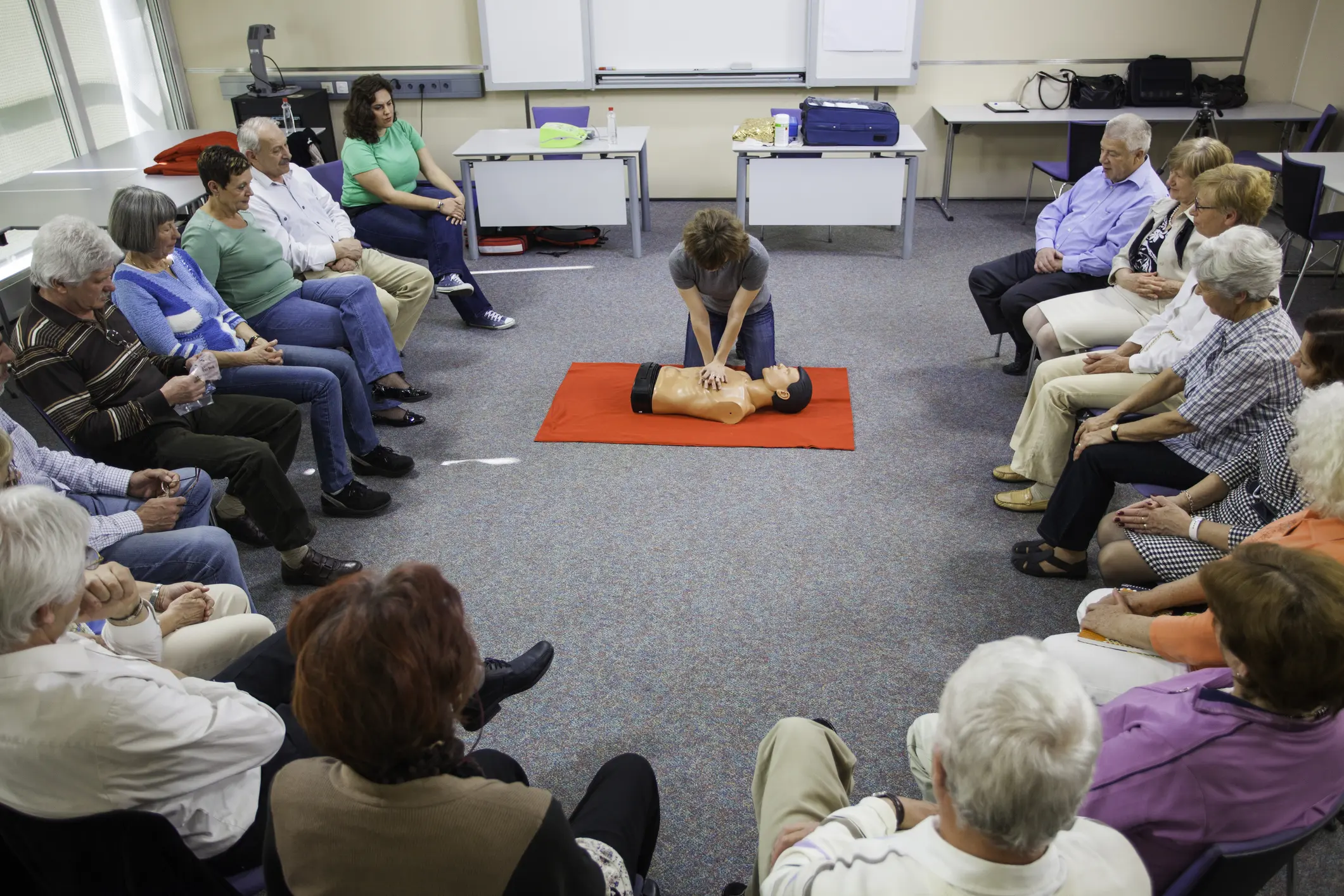 CPR training session with seated participants.
