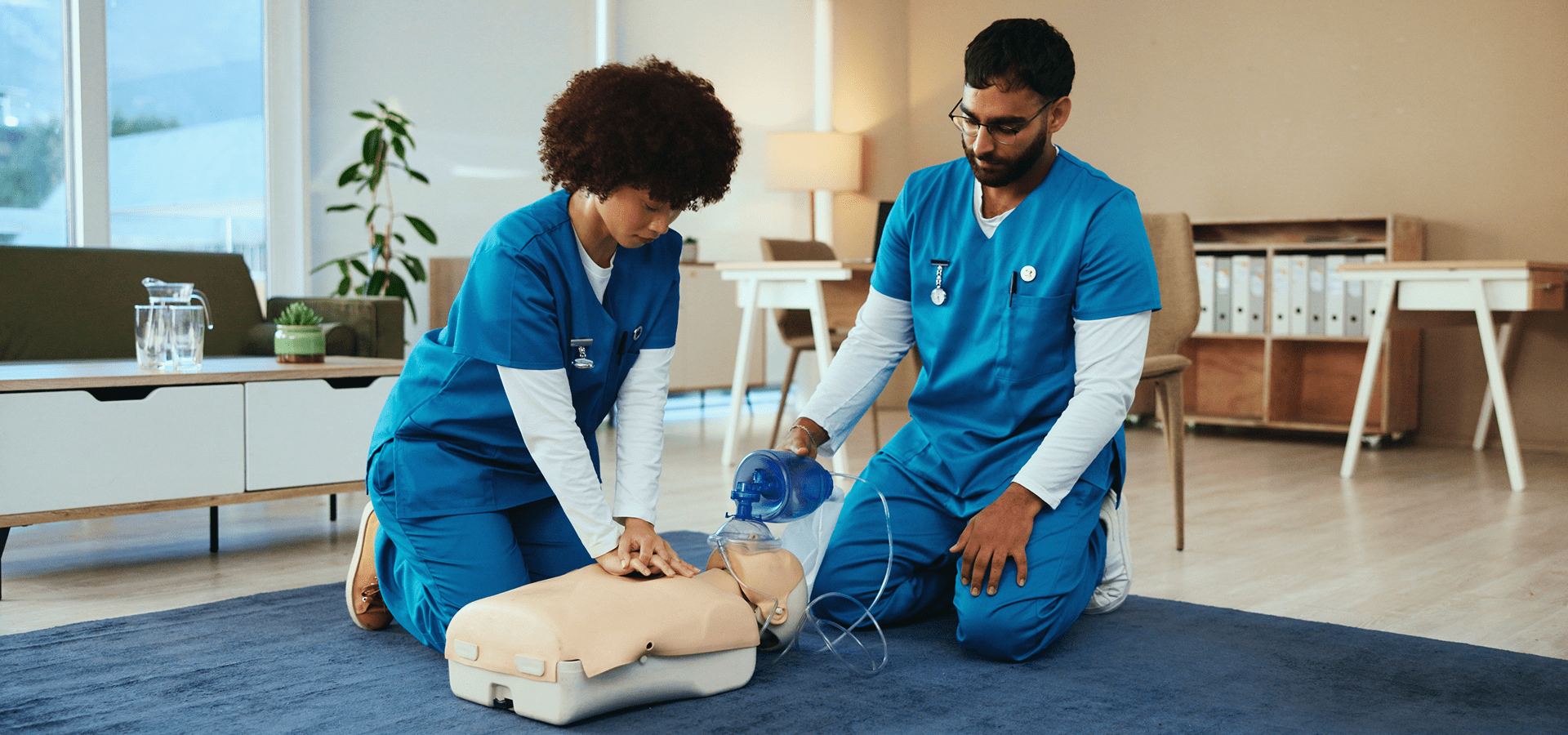 Medical professionals practicing CPR on a mannequin.