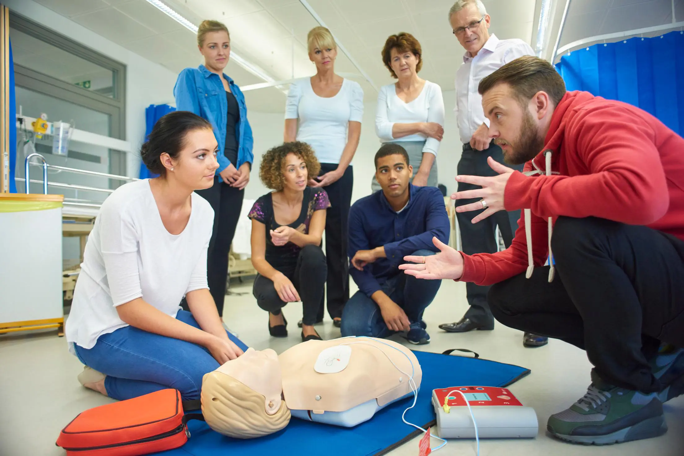 CPR training class with a dummy demonstration.